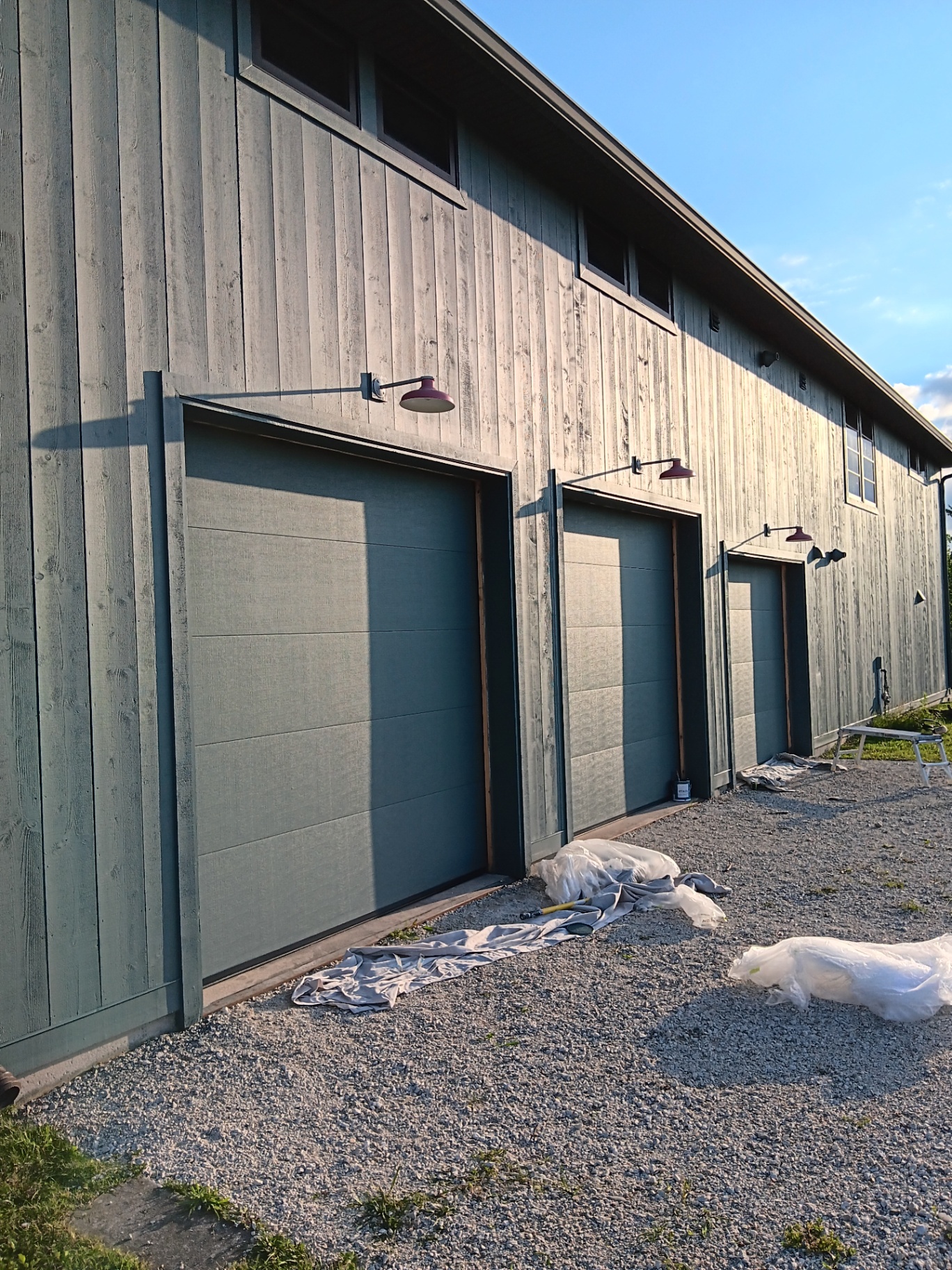 Garage exterior after painting - clean natural wood finish with contrasting trim
