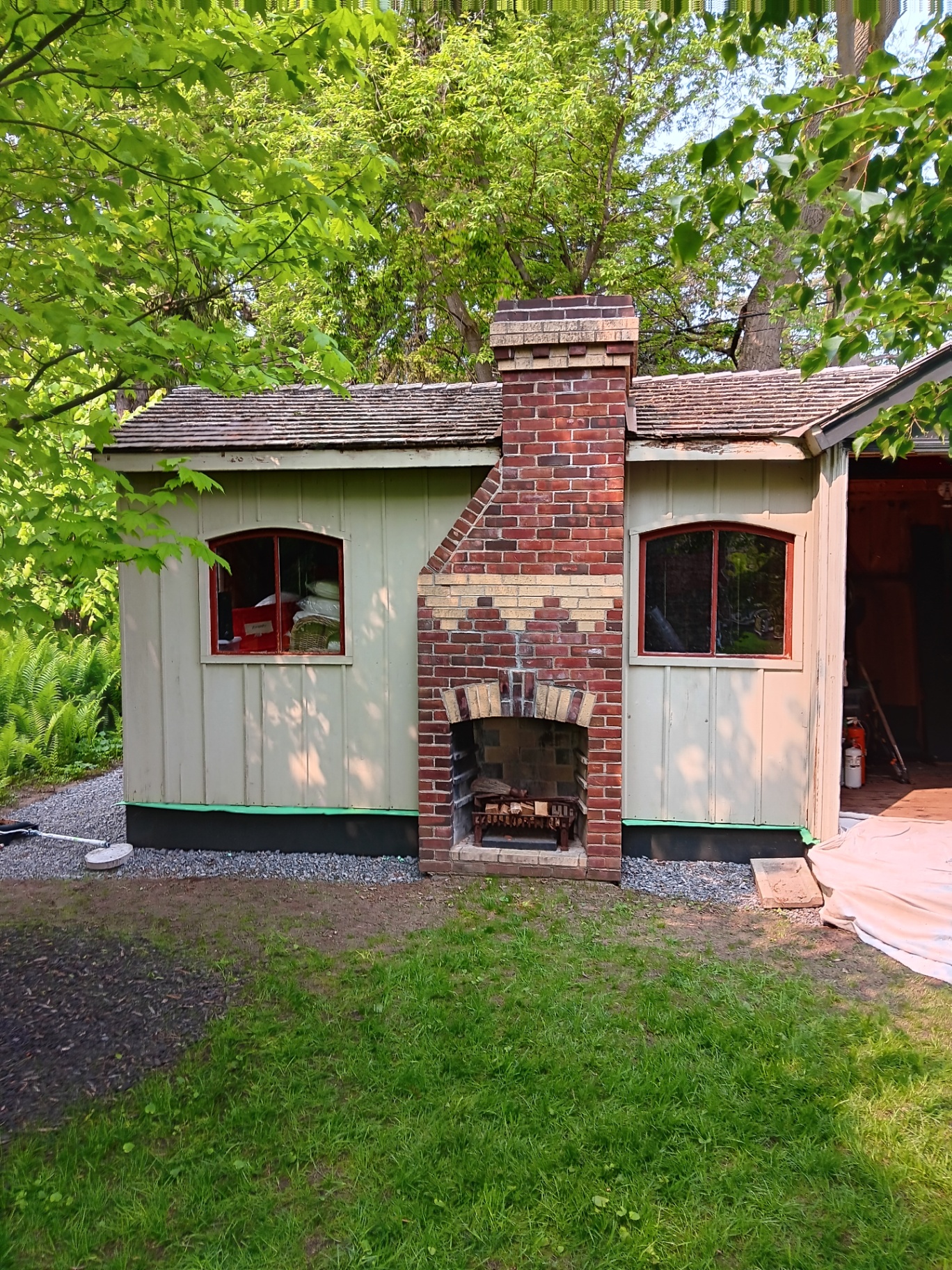 Shed exterior before painting - weathered and faded siding